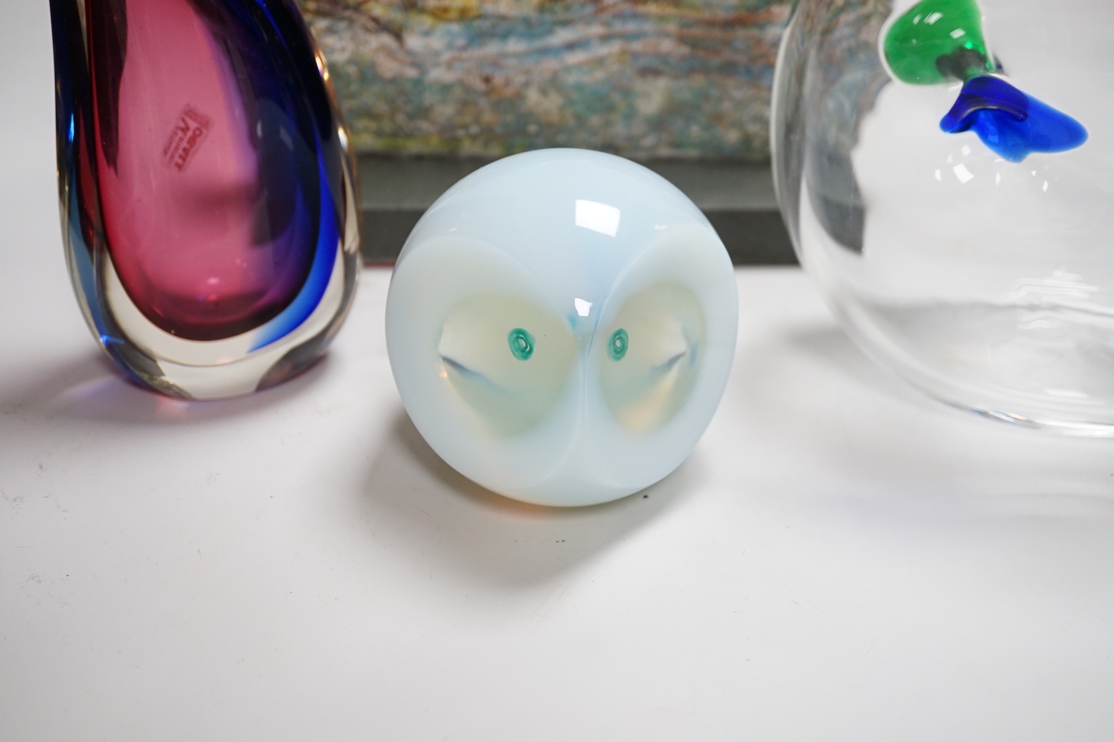 A Murano Oball Vase from Vetreria Artistica, 20cm, a free form green, blue and clear glass vase, 18cm high, an opalescent glass owl paperweight and a slumped glass slab sculpture on stand 25cms wide x 19cms